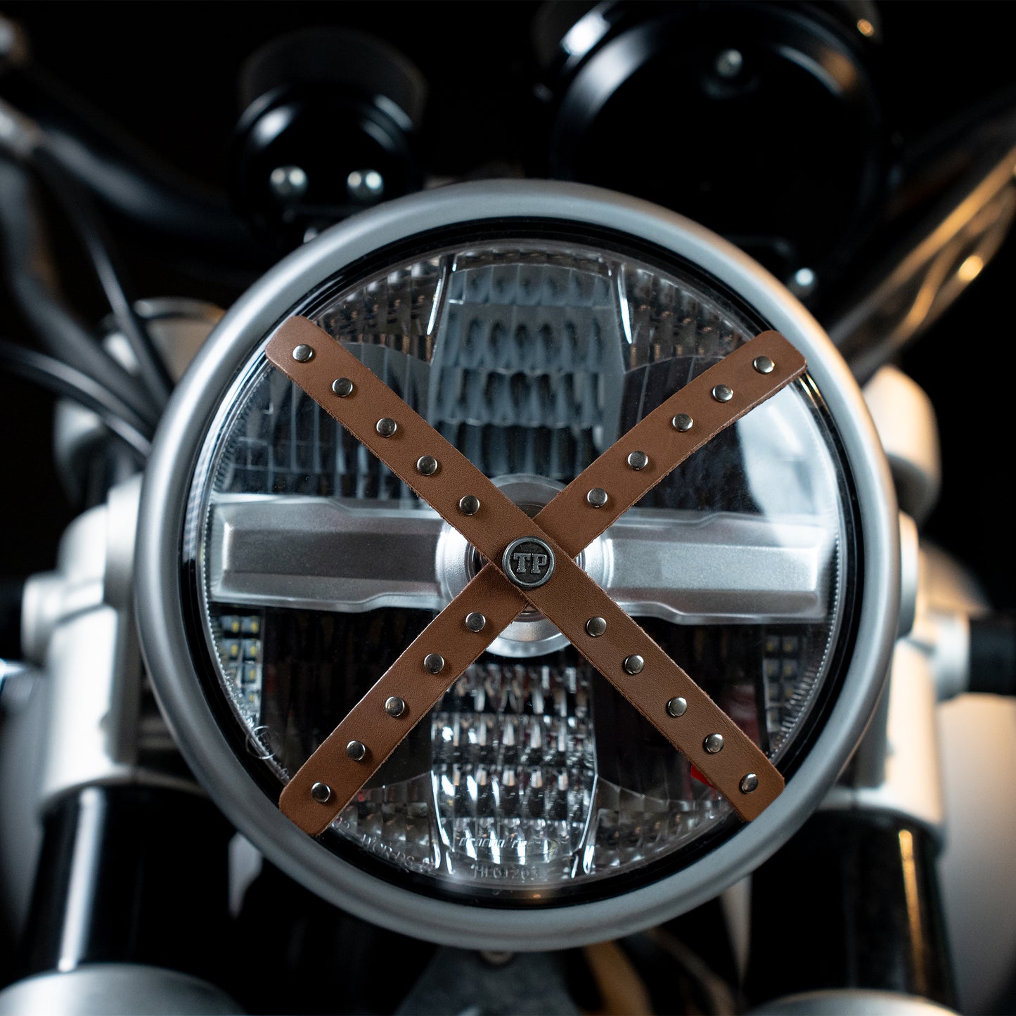 Studded Headlight Cross