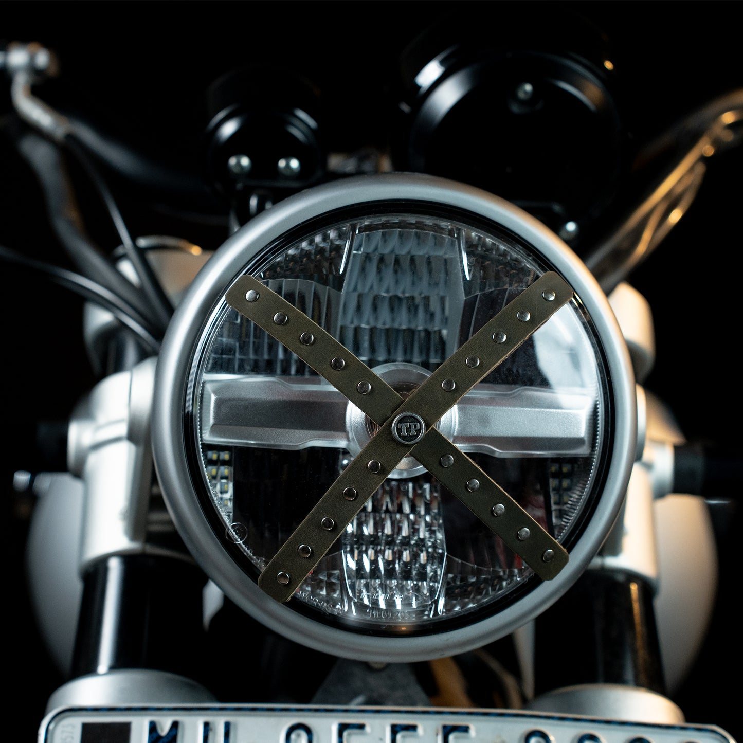 Studded Headlight Cross