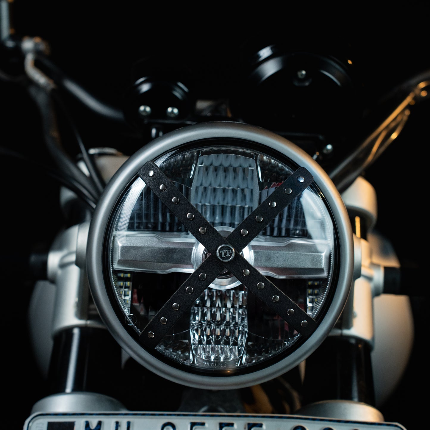 Studded Headlight Cross