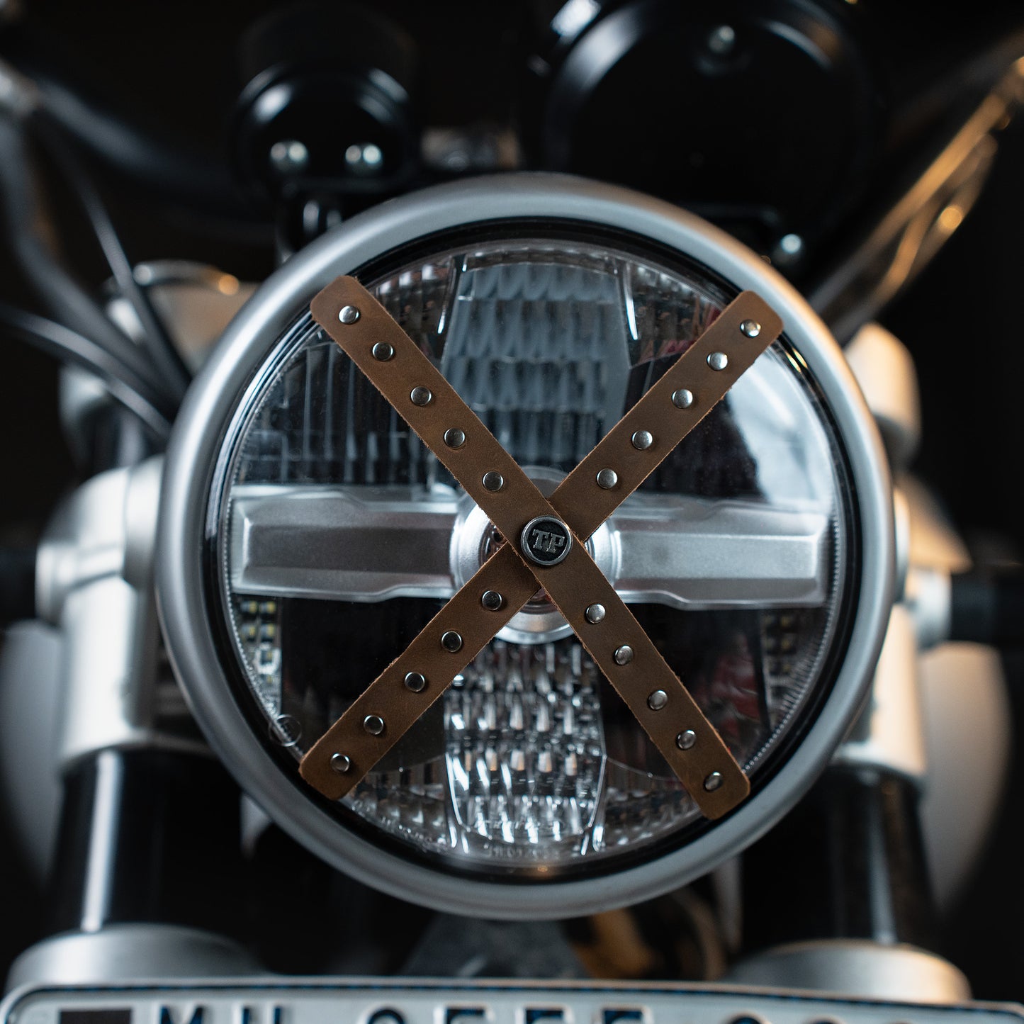 Studded Headlight Cross