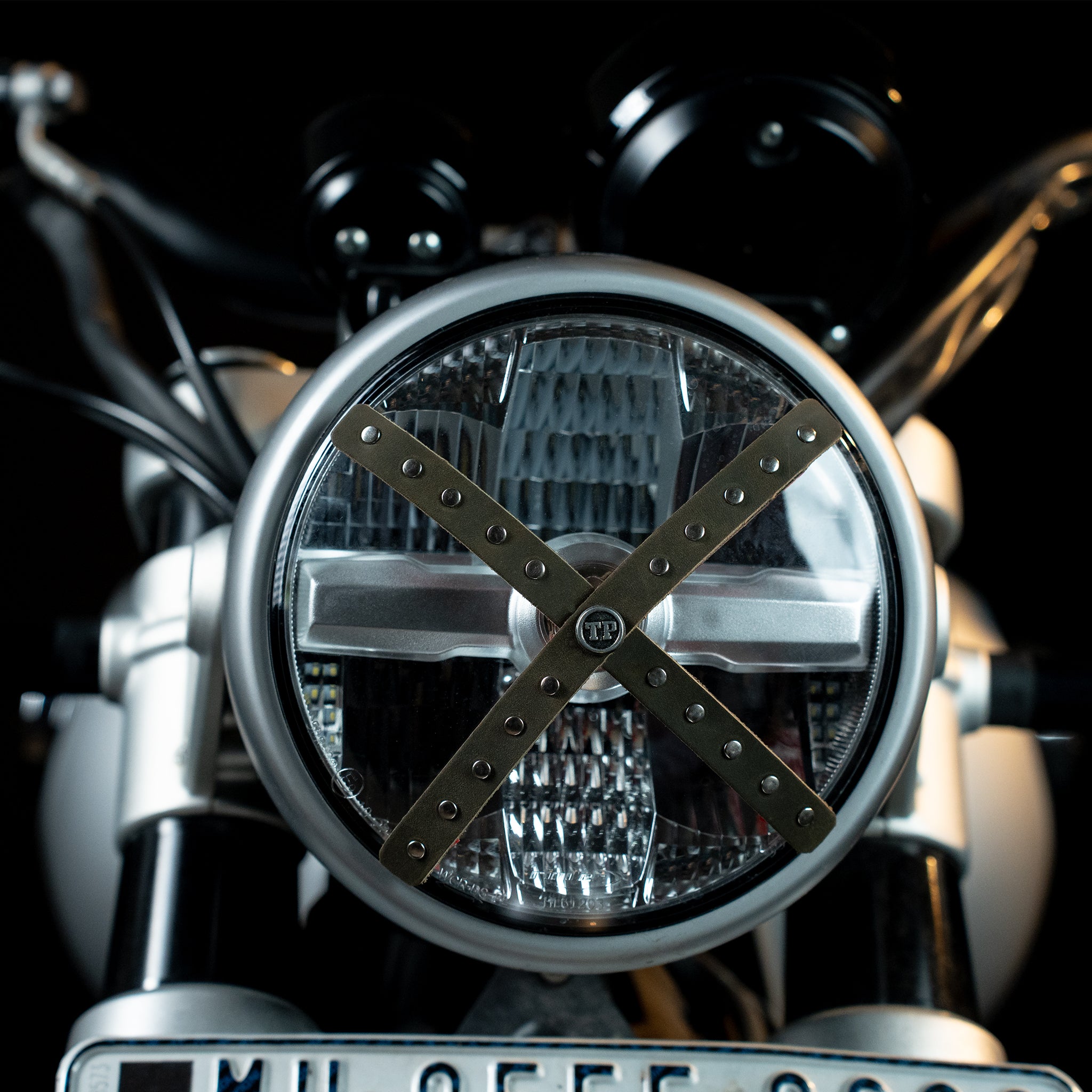 Studded Headlight Cross