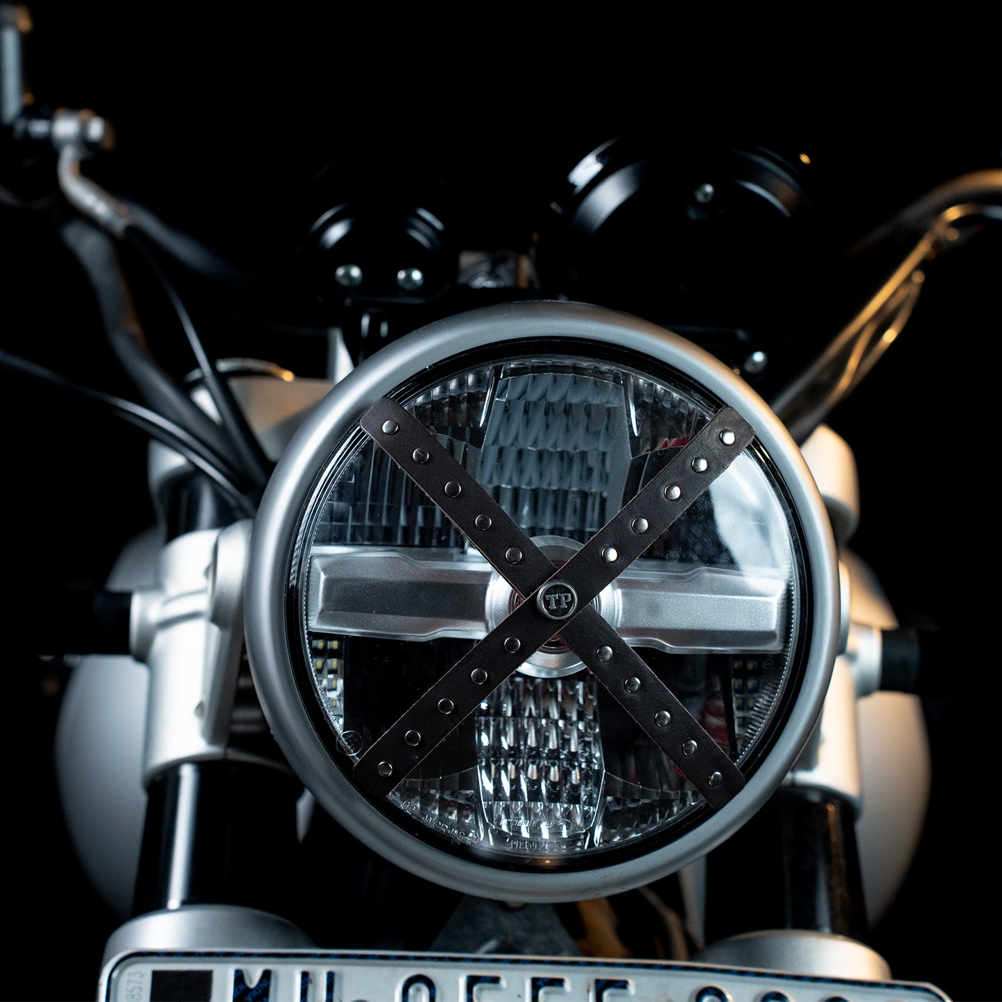 Studded Headlight Cross